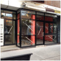 Aluminium shopfront with half bi-folds